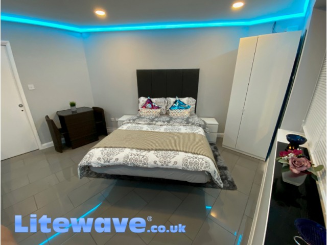 Wall Uplighting Kit in Bedroom - displaying light blue